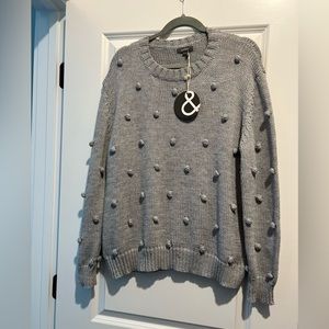 Grey sweater purchased from boutique